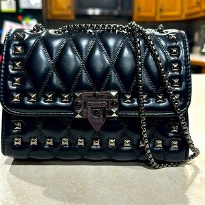 Metal cushioned bag with metal studs and chain